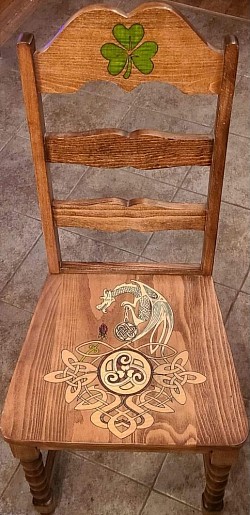 Celtic Dragon Chair – Custom Celtic knotwork, mythical creature inlay, and dyed veneers.
