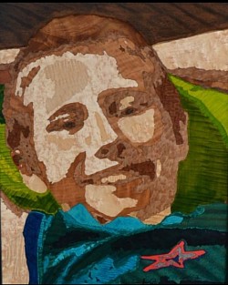 Inlay Portrait (Boy Smiling) – Life-like marquetry portrait using exotic and dyed woods.